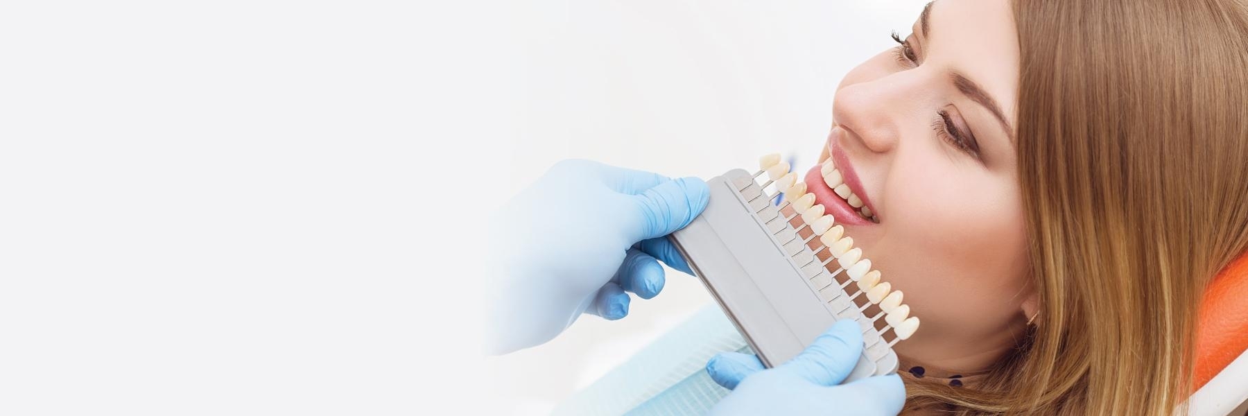 Dentist holding teeth whitening shades | Teeth Whitening Bangor ME