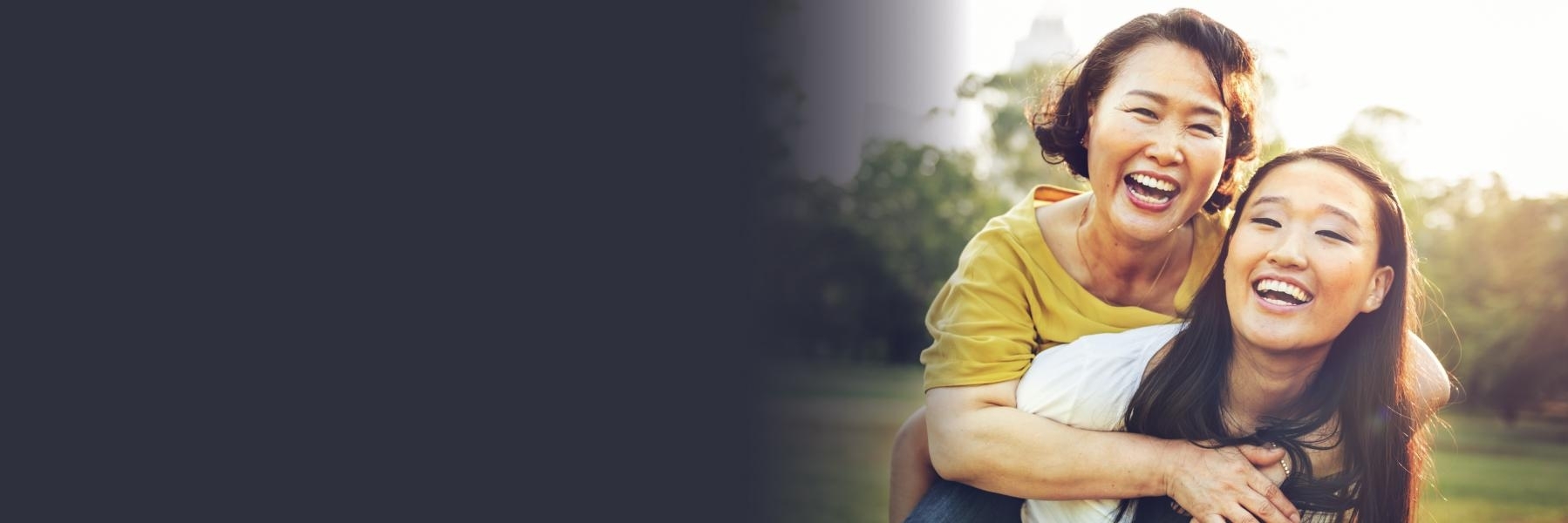 Daughter carrying mother on her back | Dental Emergencies Bangor ME