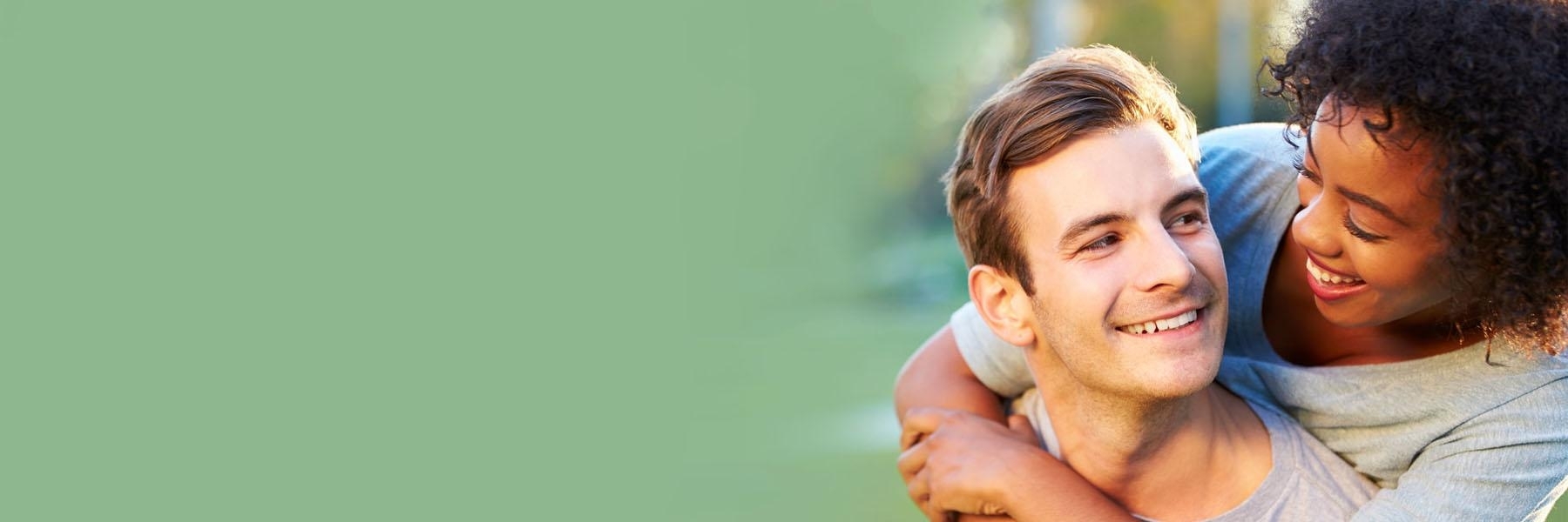 Boyfriend holding girlfriend on his back | Dental Crowns Bangor ME