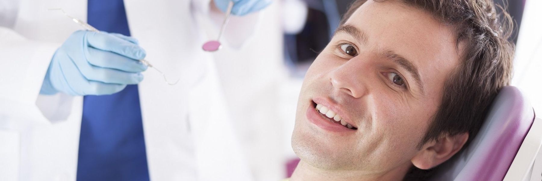 man smiling in dental chair l bangor me dentist