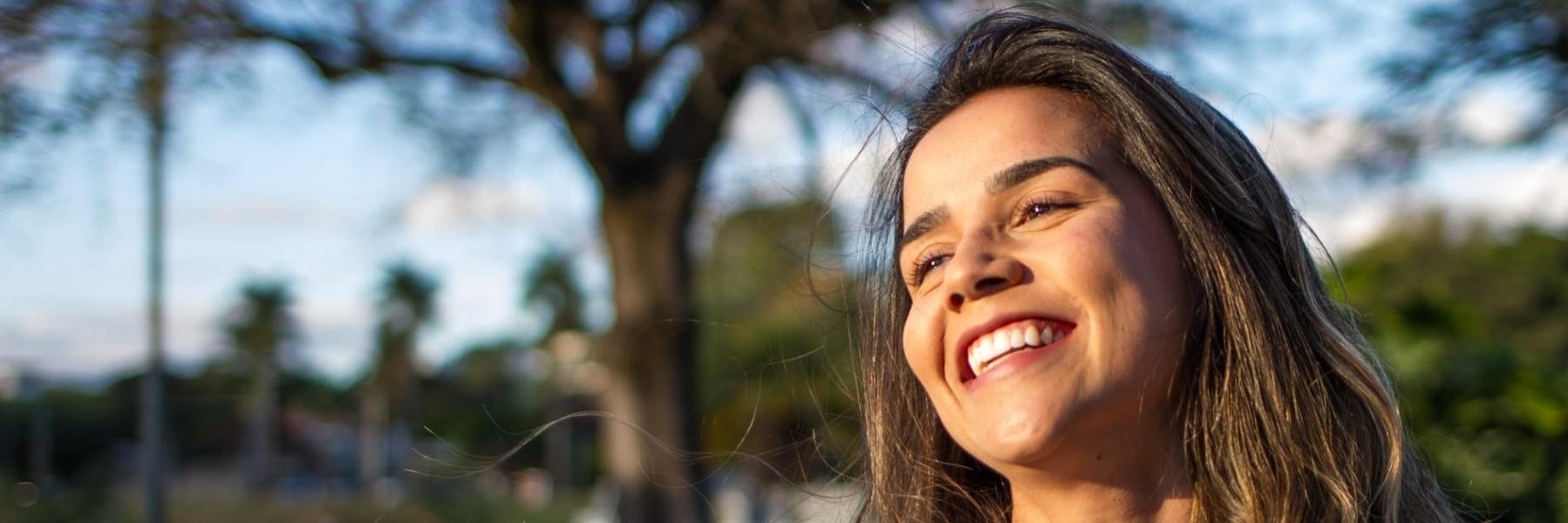 Woman smiling wearing porcelain veneers in Bangor ME