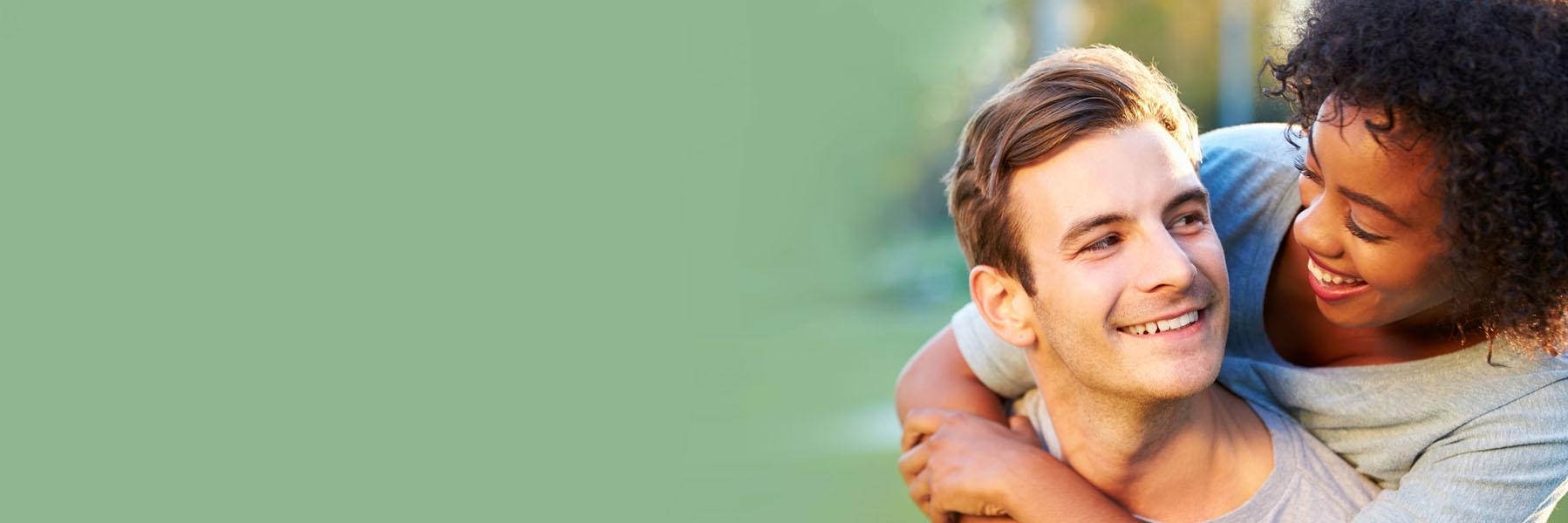 Couple Smiling at Eachother | Bangor ME Dentist